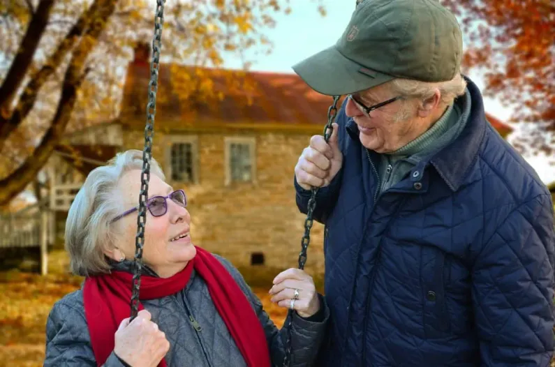 Elderly couple talking about medicare options