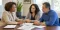 A licensed insurance professional helping a Maryland couple compare health coverage information
